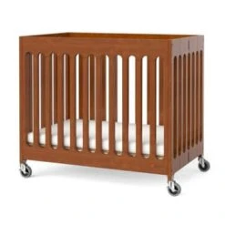 Foundations Compact Boutique™ Folding Crib,slatted Casters Foam Mattress,cherry